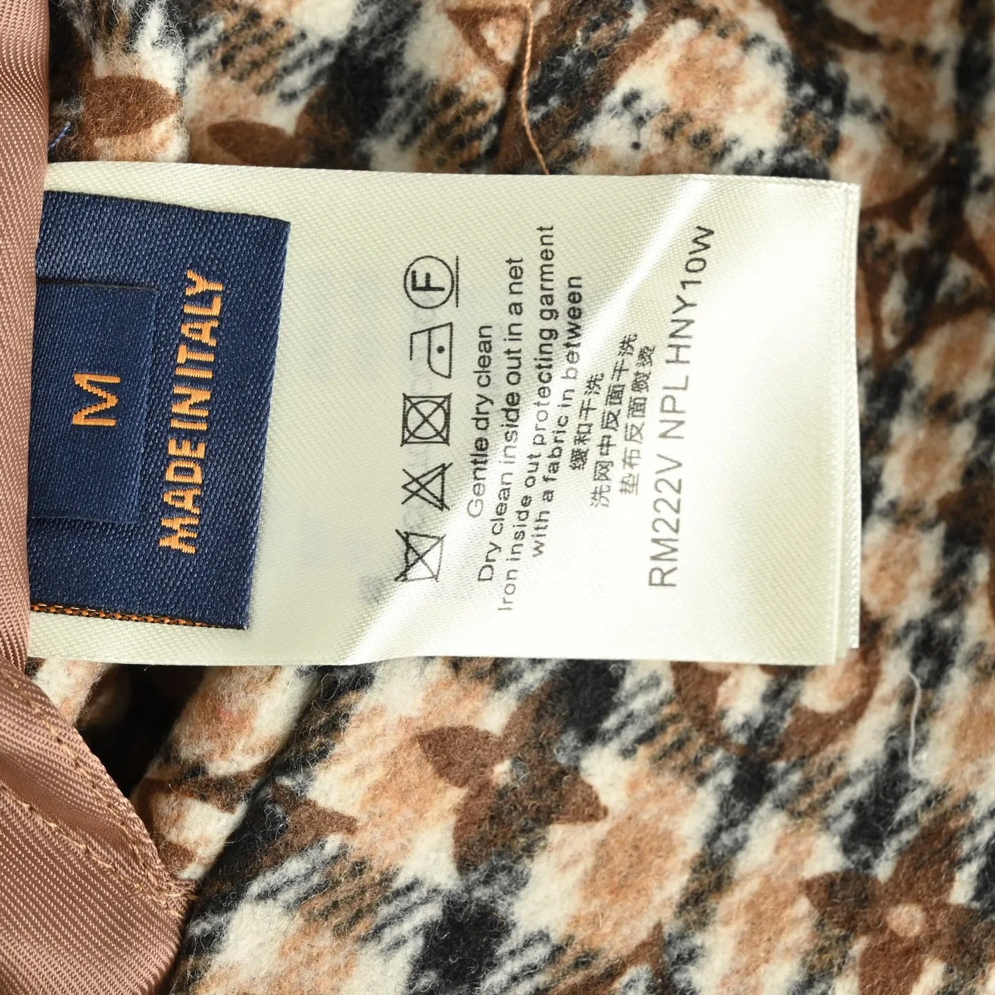 Louis Vuitton jacket with embroidered badges and all-over monogram print.